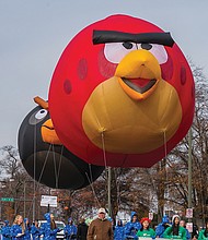 “Angry Birds” float along the parade route, bringing smiles to the crowd. 