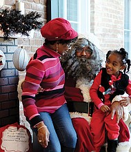 Sharing with Soul Santa //
Kennedi Ellis, 4, is shy about giving her wish list to Santa during a recent visit to the Black History Museum and Cultural Center of Virginia in Richmond’s Jackson Ward. The museum’s Soul Santa was a hit with the young — and the young at heart — during the museum’s annual holiday open house. Soul Santa made appearances on two consecutive weekends.