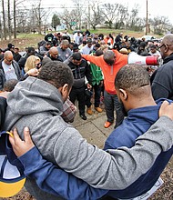 The group known as Coaches Against Violence Everywhere joined in a circle of prayer with community members in Creighton Court in January and spoke out against violence that has claimed the lives of young people in Metro Richmond.