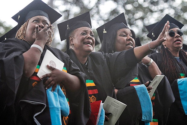 Theology school graduates at Virginia Union University, from left, Donna Cosby, Sheila Dent, Rona Evans and Alice Freeman shed tears of joy during commencement ceremonies in May. 