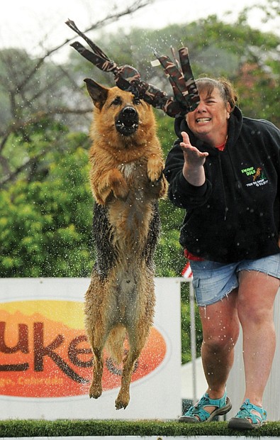 Clement Britt
Gina Johnston and Falco competed for top honors in the dog-leaping competition during Dominion River Rock festival on Brown’s Island in May.