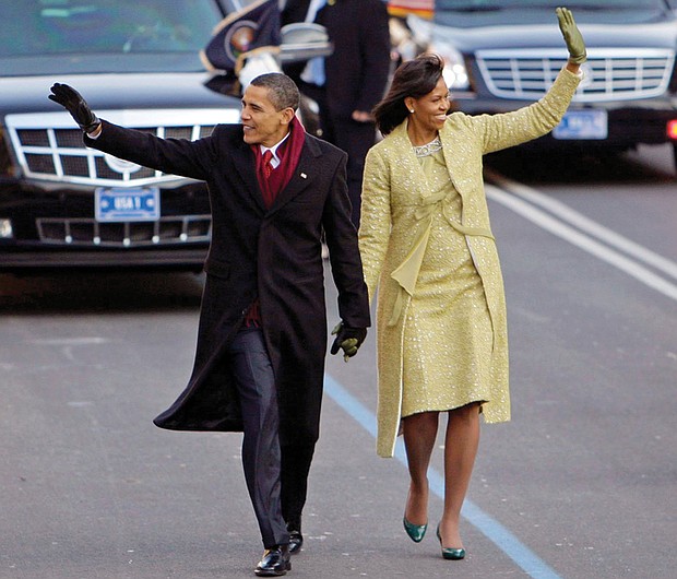 Mrs. Obama wears a two-piece lemongrass-hued ensemble by Cuban-American designer Isabel Toledo as she walks down Pennsylvania Avenue with newly sworn-in President Obama in January 2009. 