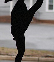 Morgan Bullock, seen in silhouette, practices one of the intricate and athletic Irish dance moves in April at the Baffa Academy of Irish Dance in Chesterfield County. The Richmond area teen placed 50th for her solo dancing in the World Irish Dance Championships.