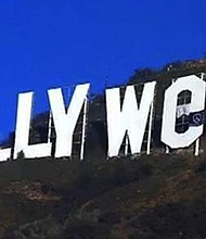 A prankster managed to change the iconic sign overlooking Los Angeles early Sunday to read "Hollyweed," said L.A. Police Officer Christopher Garcia, who works in the agency's security service division.
