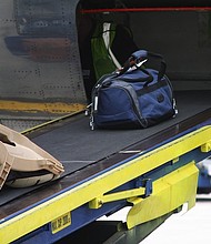 United Airlines is investigating how a baggage handler became locked in the cargo hold of a plane and remained trapped during an hourlong flight.