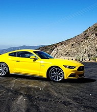 Ford announced plans Tuesday to make a hybrid version of the Mustang that will be powered by electric motors as well as a gasoline engine.