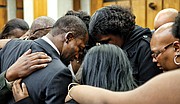Family members embrace in a prayer circle with Levar
Stoney moments before he takes the oath of offi ce as Richmond’s
mayor. On Saturday, Dec. 31, the 35-year-old became the youngest
mayor in the city’s history.