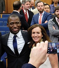 Newly installed Richmond Mayor Levar Stoney smiles for a
photo with his friend and mentor, Gov. Terry McAuliffe, and First Lady
Dorothy McAuliffe after last Saturday’s swearing-in ceremony at City
Hall.