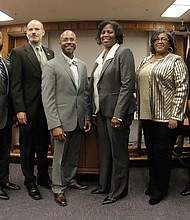 Richmond’s new School Board members pose at City Hall after their swearing-in on Tuesday. They are, from left, Elizabeth “Liz” Doerr, 1st District; J. Scott Barlow, 2nd District; Jeff Bourne, 3rd District; Jonathan Young, 4th District; Vice Chairman Dr. Patrick Sapini, 5th District; Chairwoman Dawn Page, 8th District; Felicia Cosby, 6th District; Nadine Marsh-Carter, 7th District; and Linda Owen, 9th District.