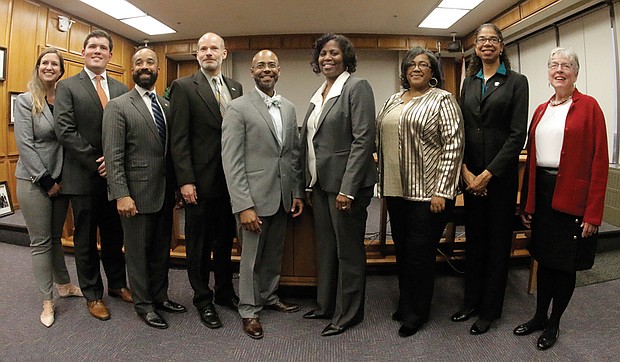 Richmond’s new School Board members pose at City Hall after their swearing-in on Tuesday. They are, from left, Elizabeth “Liz” Doerr, 1st District; J. Scott Barlow, 2nd District; Jeff Bourne, 3rd District; Jonathan Young, 4th District; Vice Chairman Dr. Patrick Sapini, 5th District; Chairwoman Dawn Page, 8th District; Felicia Cosby, 6th District; Nadine Marsh-Carter, 7th District; and Linda Owen, 9th District.