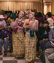 Imani Bell, left, and Casey Jones lead the procession for the 2016 Capital City Kwanzaa Festival last Friday at the Altria Theater.
Scores of people attended the annual festival produced by Janine Y. Bell of the Elegba Folklore Society. Highlights included music and dance, lectures, panels and workshops focusing on the seven principles of Kwanzaa.
