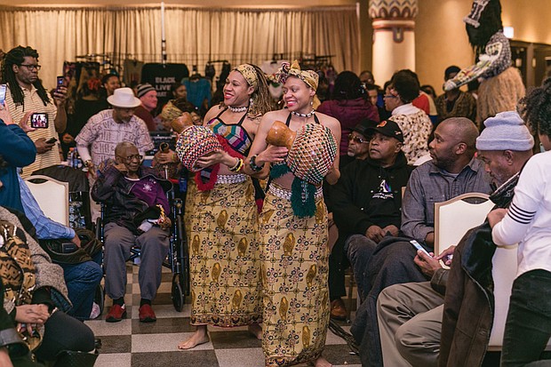 Celebrating Kwanzaa // Imani Bell, left, and Casey Jones lead the procession for the 2016 Capital City Kwanzaa Festival last Friday at the Altria Theater.
Scores of people attended the annual festival produced by Janine Y. Bell of the Elegba Folklore Society. Highlights included music and dance, lectures, panels and workshops focusing on the seven principles of Kwanzaa.

 