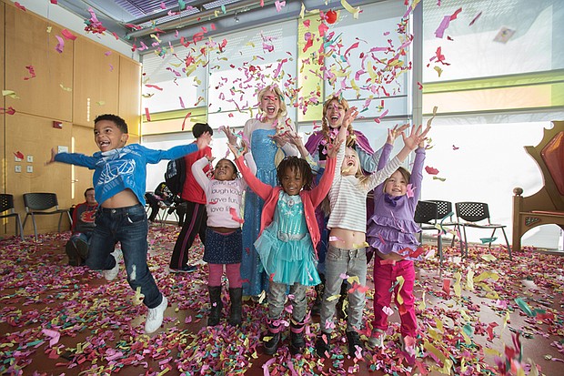 Party like it’s 2017! //
Children from around Metro Richmond throw confetti and whoop it up at their own “Noon Year’s Eve Bash” last Saturday at the Children’s Museum of Richmond. The New Year’s Eve celebration, held 12 hours before most adult celebrations, included a grand parade, led by the museum mascot, Seymour the Dinosaur, and a toast with juice boxes. “Anna” and “Elsa,” characters from the highly popular 2013 Disney film “Frozen,” joined the youngsters in ushering in 2017 and learning about New Year’s celebrations and customs from around the world.