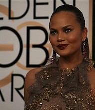 	Chrissy Teigen at the 74th annual Golden Globe Awards