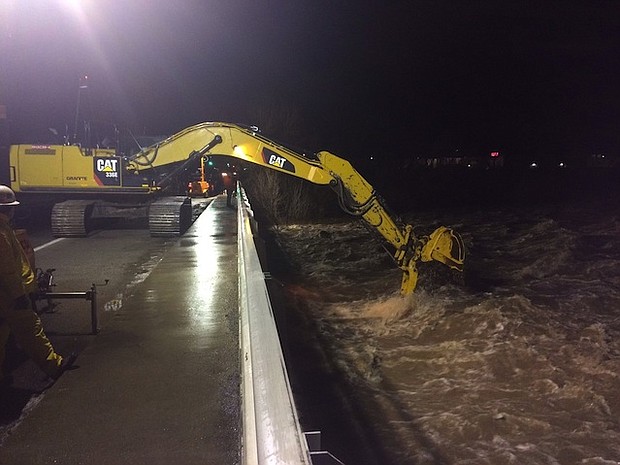 California, Nevada and other parts of the West were bracing Monday, January 9, 2017 for more flooding, mudslides and heavy snow after winter storms pummeled the region over the weekend. Pictured is an image of the flood in the streets of Nevada.