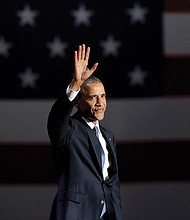 President Obama waves to the crowd as he takes the stage in Chicago on Tuesday to deliver his farewell address.