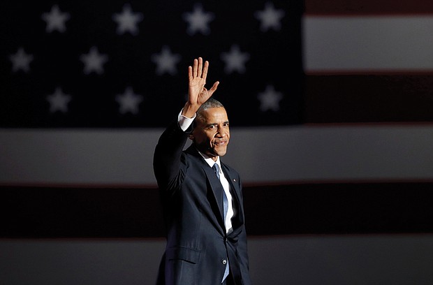 President Obama waves to the crowd as he takes the stage in Chicago on Tuesday to deliver his farewell address.