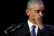 President Obama wipes away tears during an emotional moment in his address