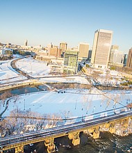 Ribbons of clear roads and tracks cut through the snowy landscape in this drone’s view of Downtown in Sunday’s sunshine.