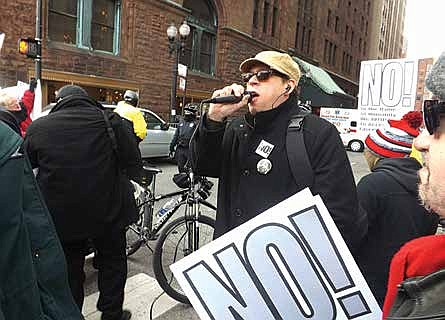 Tedd Sirot, Initiator for the Refuse Fascism group in Chicago speaks at a recent protest held
at the Chicago Club located in the loop. Photo Credit: Gregg Greer