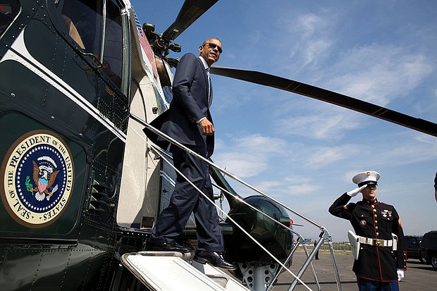 President Obama disembarks from Marine One at the Brackett Field landing zone in San Dimas, Calif., in October 2014.