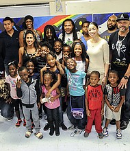 City Councilwoman Amanda Edwards, artist Reginald Adams, other artists, and youth of Cuney Homes
