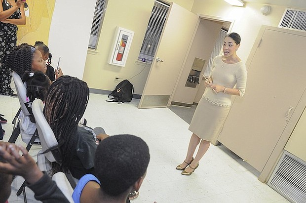 City Councilwoman Amanda Edwards speaking with Cuney Homes children