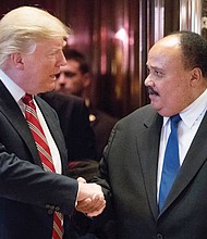 President-elect Donald Trump thanks Martin Luther King III, son of the late civil rights champion Dr. Martin Luther King Jr., following their meeting last Monday at Trump Tower in New York City. 
