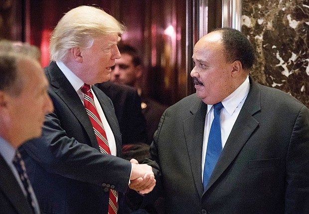 President-elect Donald Trump thanks Martin Luther King III, son of the late civil rights champion Dr. Martin Luther King Jr., following their meeting last Monday at Trump Tower in New York City. 
