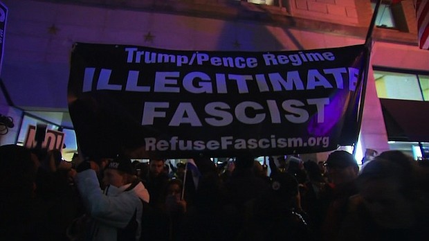 	Protesters and Washington police scuffled Thursday outside a meeting of pro-Donald Trump conservatives, the first of several demonstrations aimed at disrupting the new administration's inaugural weekend.