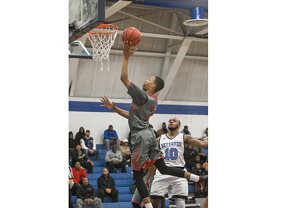 George Wythe High School’s Darrell Purdie puts up a shot against L.C. Bird High School’s Johquin Wiley during a game Jan. 4. The Wythe Bulldogs won the game and are now 7-3.