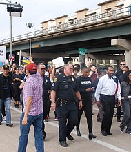 Rep. Al Green marching to City Hall with fellow marchers at Houston Women’s March.