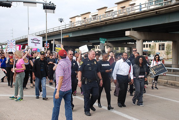 Rep. Al Green marching to City Hall with fellow marchers at Houston Women’s March.