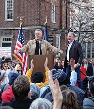 Supporting Obamacare //
Gov. Terry McAuliffe, left, and U.S. Sen. Tim Kaine rally Virginians against Republican plans to repeal the Affordable Care Act, or Obamacare, during an event last Sunday in Capital Square. 
Nearly 1,000 people attended the event, which was joined by several other state, local and federal elected officials, including Lt. Gov. Ralph S. Northam, Rep. A. Donald McEachin of Richmond and Rep. Robert C. “Bobby” Scott of Newport News.
The rally at the Bell Tower was one of dozens held across the United States last weekend to coalesce support for saving the health insurance program. Republicans have made repeal of the Affordable Care Act a priority with the election of President-elect Donald Trump.
More than 400,000 Virginians and 20 million Americans have enrolled in health insurance plans since the law was passed in 2010.
Sen. Kaine, who ran unsuccessfully as the Democratic vice presidential candidate, is encouraging Virginians to share how the ACA has helped them or a family member, or to offer suggestions for improvement. Stories may be submitted by visiting www.kaine.senate.gov/acastory.
