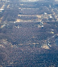 Left, nearly 2 million people crowd the National Mall for President Obama’s inauguration Jan. 20, 2009, as the nation’s 44th and first African-American president.