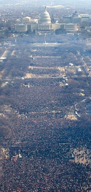 Left, nearly 2 million people crowd the National Mall for President Obama’s inauguration Jan. 20, 2009, as the nation’s 44th and first African-American president.