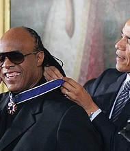 
President Obama awards singer Stevie Wonder the Presidential Medal of Freedom during a White House ceremony in November 2014.