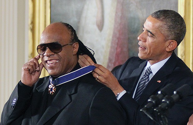 
President Obama awards singer Stevie Wonder the Presidential Medal of Freedom during a White House ceremony in November 2014.