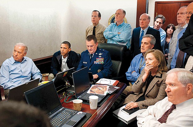 President Obama, cabinet members and staff watch inside the Situation Room as U.S. forces raid Osama bin Laden’s compound in Pakistan, killing the terrorist leader in May 2011.