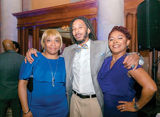 Family members of the new mayor enjoy the $100-per-person reception last Friday at Main Street Station in Shockoe Bottom. They are, from left, Mayor Stoney’s mother, Cassandra James; nephew, Marcus Curtis; and aunt, Troyce Fitzgerald.