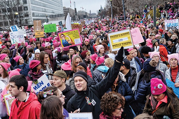 Throngs of people, many wearing signature knit pink hats, crowd Independence Avenue last saturday for the Women’s March on Washington.