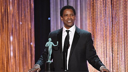 Actor Denzel Washington accepts Outstanding Performance by a Male Actor in a Leading Role for 'Fences' onstage during the 23rd Annual Screen Actors Guild Awards show at The Shrine Auditorium on January 29, 2017 in Los Angeles, California. / AFP / Robyn BECK 