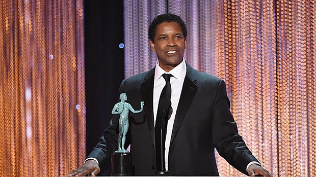 Actor Denzel Washington accepts Outstanding Performance by a Male Actor in a Leading Role for 'Fences' onstage during the 23rd Annual Screen Actors Guild Awards show at The Shrine Auditorium on January 29, 2017 in Los Angeles, California. / AFP / Robyn BECK 