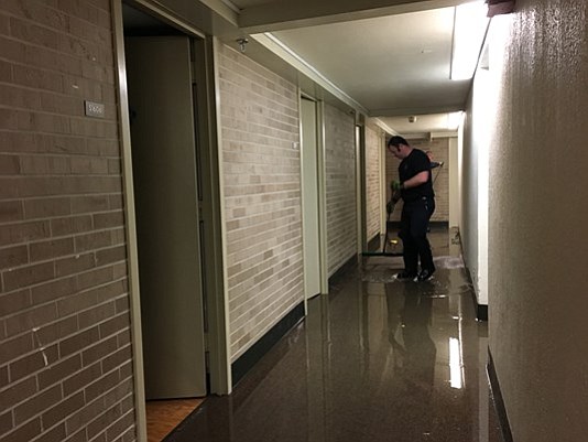 Stagnant water can be seen in one of the UH dorm hallways Sunday evening.