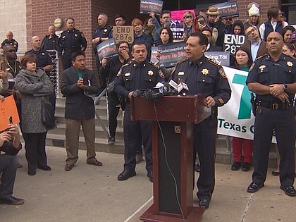 Immigration rights activists gathered outside the Harris County Sheriff’s Office in opposition to Trump’s executive orders signed Wednesday.