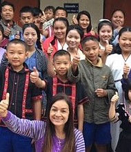 Tutu Bee (front center), the director for Asia's Hope Thailand, lives with 24 children in the Doi Saket 4 orphanage home, the home built with Jerod Cherry's donation. Courtesy of Asia's Hope