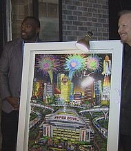 Texans linebacker Whitney Mercilus was out on the town Tuesday helping unveil a special piece of art made specifically for the Super Bowl.