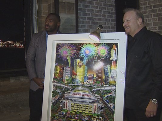 Texans linebacker Whitney Mercilus was out on the town Tuesday helping unveil a special piece of art made specifically for the Super Bowl.