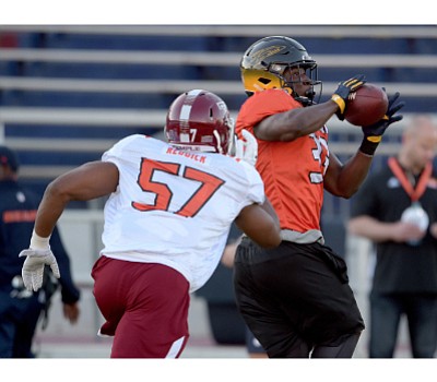 Temple linebacker Haason Reddick attempts to tackle Toledo tight end Michael Roberts during a north team practice at the Reese's ... Temple linebacker Haason Reddick attempts to tackle Toledo tight end Michael Roberts during a north team practice at the Reese's ...