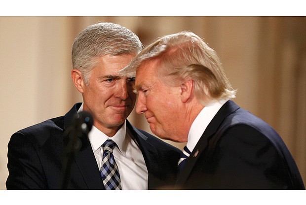 Federal Judge Neil Gorsuch receives congratulations Tuesday from President Trump at the White House after becoming the nominee to replace the late Antonin Scalia on the U.S. Supreme Court.   